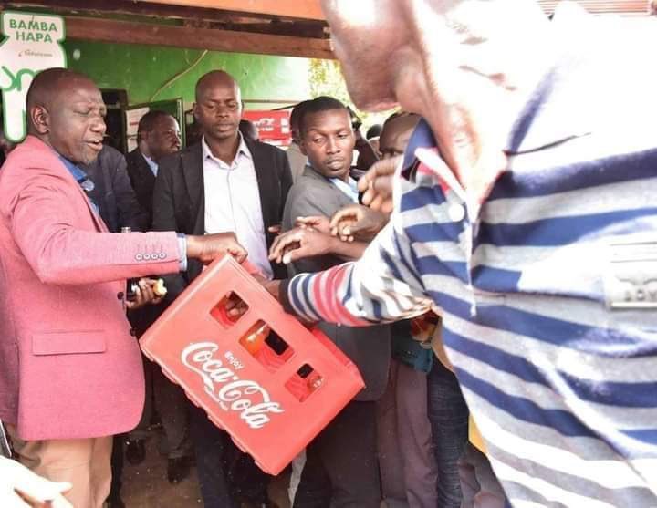 DP William Ruto distributing soda.