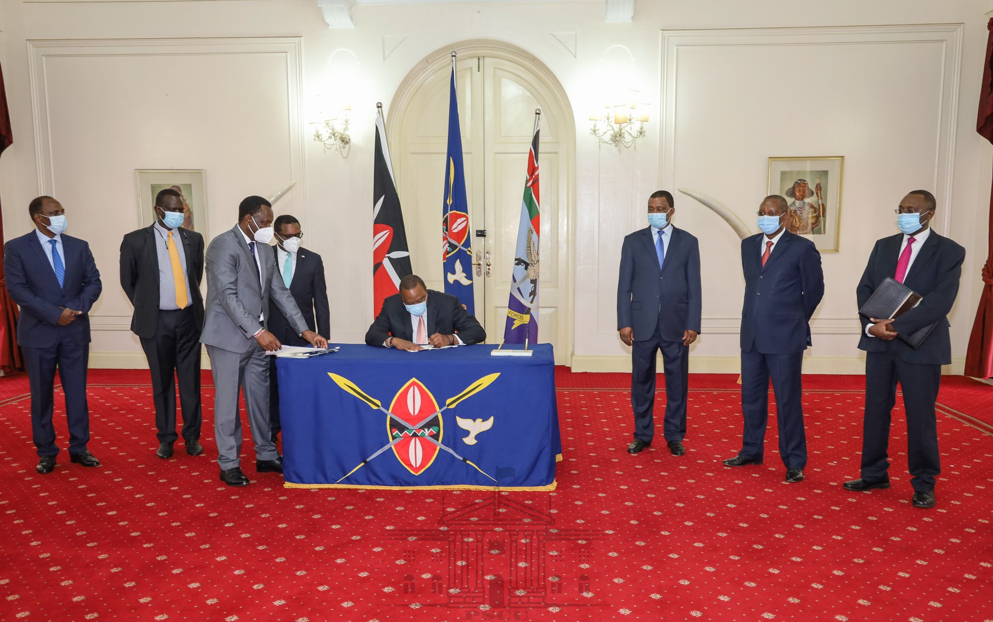 President Uhuru Kenyatta signing The 2020/21 County Revenue Allocation Bill Into Law. [Photo: PSCU]