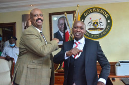 Acting Nairobi Governor Benson Mutura is congratulated by NMS Director Mohamed Badi