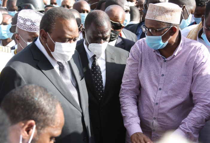 President Uhuru Kenyatta, DP William Ruto and Garissa Township MP Aden Duale at Langata Cemetery for the burial of Senator Yusuf Haji 