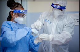 UN Volunteers Tabitha Shali (left), Nursing Officer, and Alex Munguti, Laboratory Technologist, prepare COVID-19 swabs for laboratory processing and analysis at Moi Referral Hospital, Voi, Taita Taveta County. © UNDP Kenya, 2020