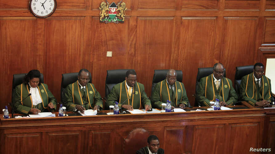File image of Kenya's Chief Justice Willy Mutunga (3rd L) leads Supreme Court judges (L-R) Njoki Ndung'u, Philip Tunoi, Jackton Ojwang, Mohamed Ibrahim and Smokin Wanjala, in Nairobi, March 30, 2013. Kenya's Chief Justice 