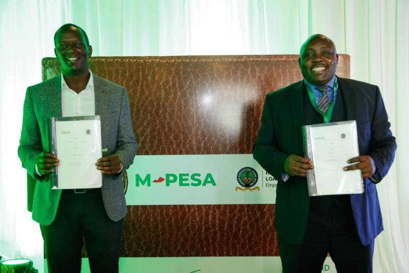 Safaricom Chief Financial Services Officer, Sitoyo Lopokoiyit with HELB CEO, Charles Ringera at the launch of a HELB M-PESA student loans smart payment solution on 2nd March 2021 at Safaricom Head Office.