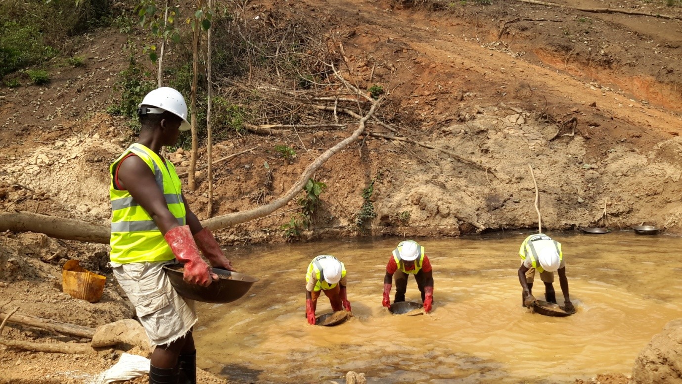 File image of miners sieving gold from a river basin. |Photo| Courtesy|