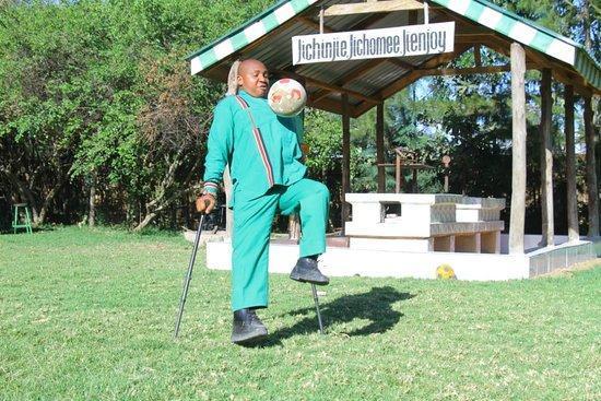 MP Ole Sankok plays with a football at the OSIM Country Lodge. |Photo| Courtesy|
