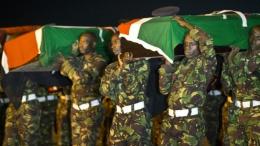 KDF Soldiers carry the remains of their fallen colleagues killed during an attack in El Adde, Somalia on January 15, 2016. |Photo| Courtesy|