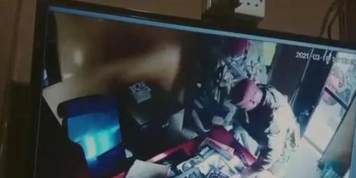 Officers caught on camera during a raid on Thursday, March 18, 2021. |Courtesy| Youtube|