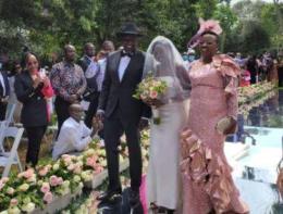 Deputy President William Ruto and his wife Rachel Ruto walking their daughter June down the aisle.