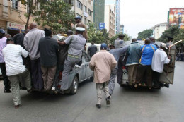File image of Nairobi City County inspectorate officer hanging to squad cars. |Photo| Courtesy|