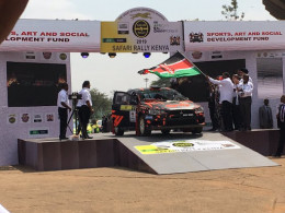 A rally car being flagged off