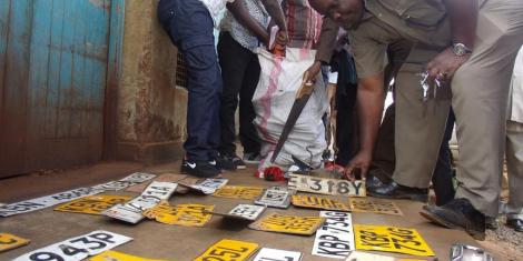 Police Collect Car Number Plates after Arresting Car Thieves 