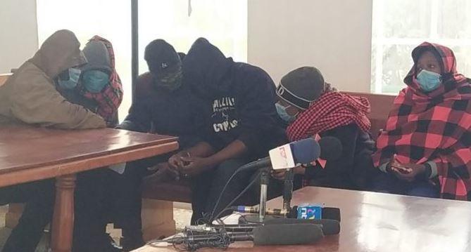 The six police officers arrested over the murder of the Kianjokoma Brothers at the Milimani Law Courts on August 17, 2021.