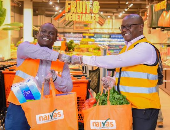 Willy Kimani, Chief Commercial Officer, Naivas (left) with Kenneth Oyolla, Chief Commercial officer, Jumia Kenya after signing the deal between the two companies. 