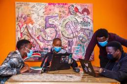 Former Moringa students with Development Lead at MyMovies.Africa, Brian Waweru (middle) during a learning session. The two institutions have inked a partnership deal that will seek to equip Moringa students with hands on experience in improving the custom