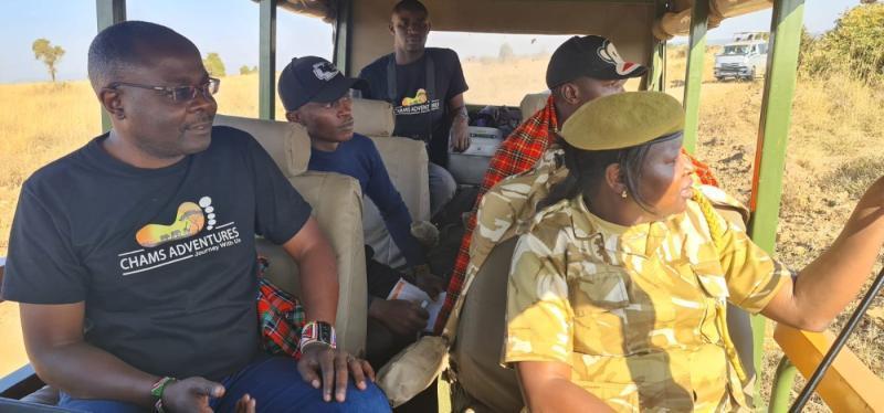 File image of Alex Chamwada (left) during a tour with Chams Adventures. |Courtesy| Facebook|