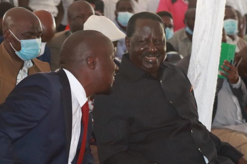 Dennis Onsarigo and ODM leader Raila Odinga.