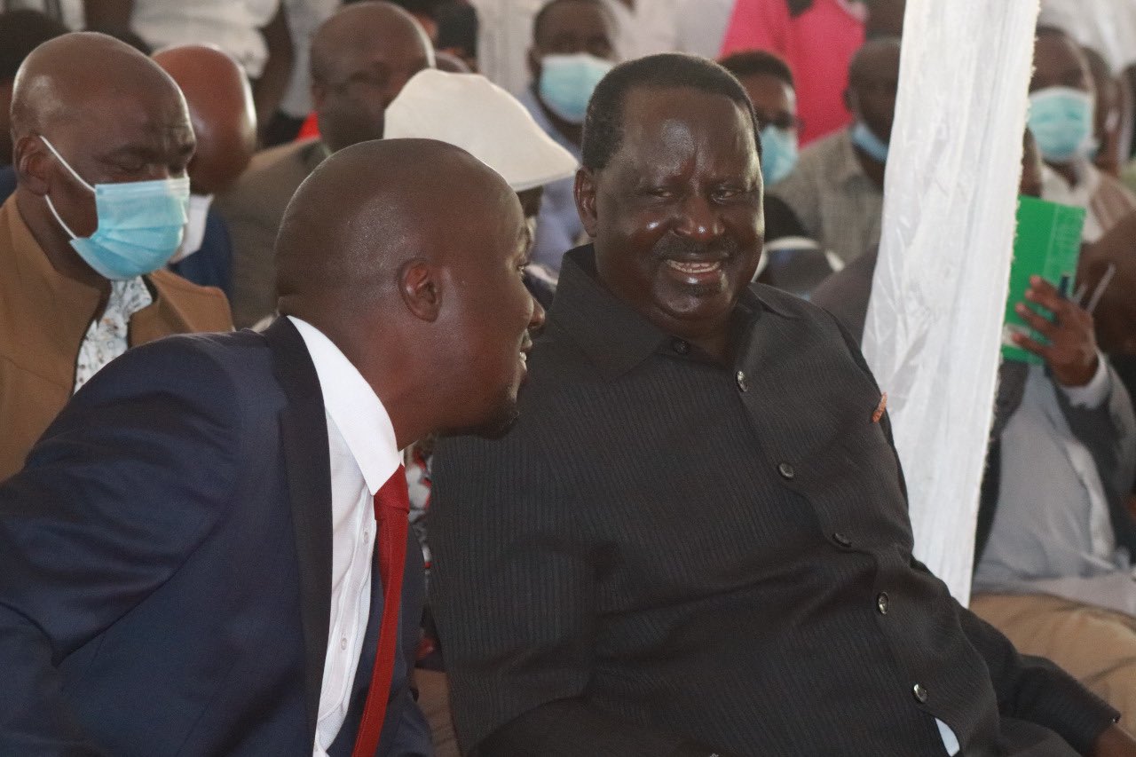 Dennis Onsarigo and ODM leader Raila Odinga. 