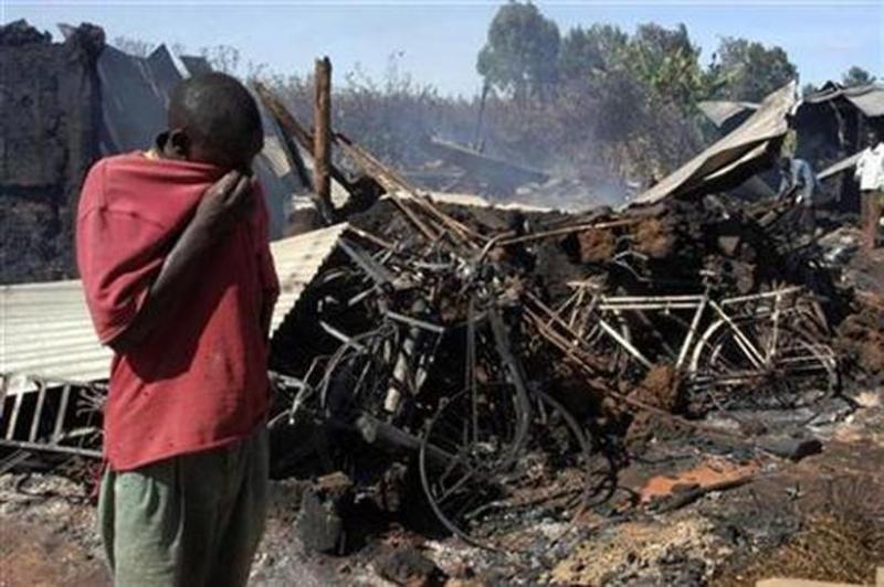 File image of a man outside the KAG Kiambaa Church after it was burnt down during the 2008 PEV. |Courtesy| Reuters|
