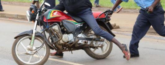 File image of a rider attempting to escape from police officer. 