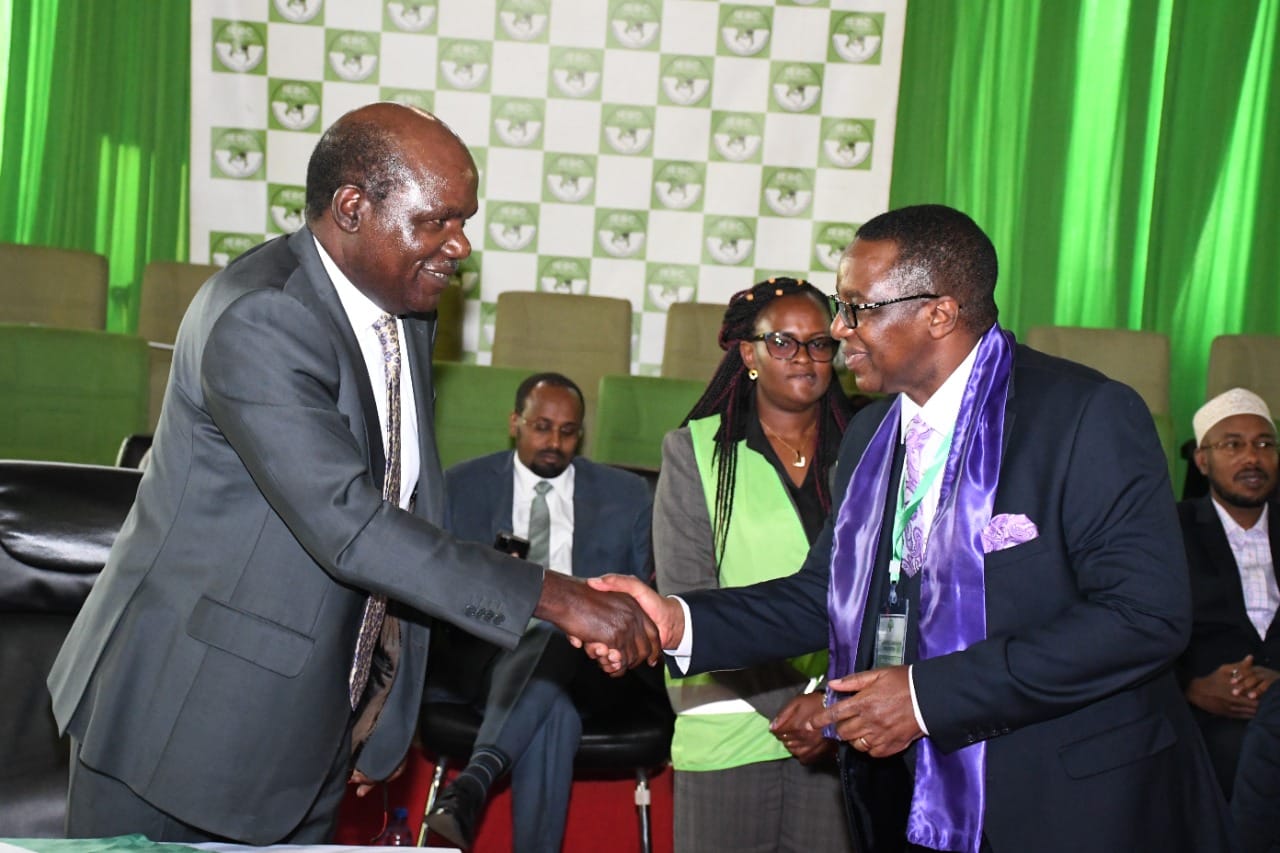 IEBC chairman Wafula Chebukati and Agano Party presidential candidate David Mwaure. 