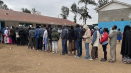 Kenyans queue at one of the polling stations to vote on Tuesday.