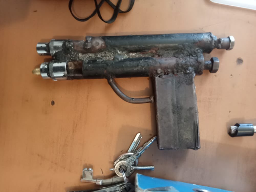 Detectives have arrested a 23-year-old robbery suspect with a homemade gun capable of firing.