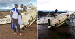 David Rudisha posing beside the wreckage of the light aircraft.