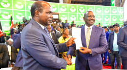 File image of President William Ruto and IEBC chair Wafula Chebukati.