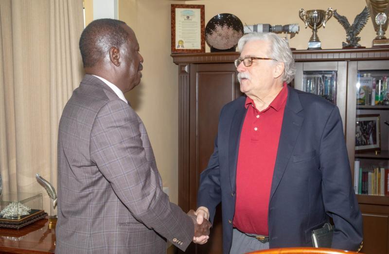 File image of Raila Odinga and Jim Adams.