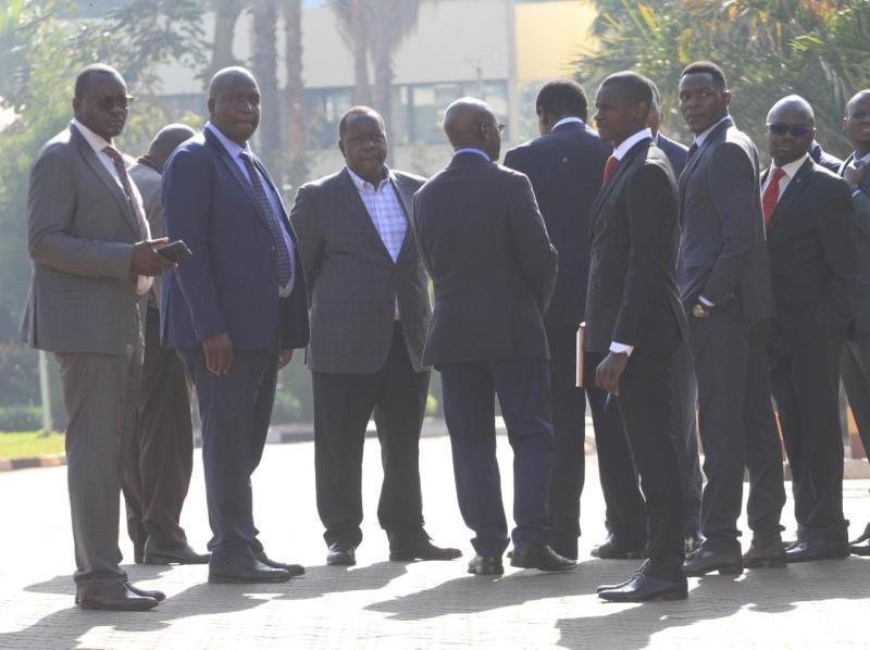 Former CS Fred Matiang'i at DCI Headquarters with a team of his lawyers.