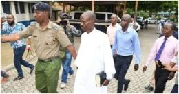 Pastor Ezekiel Odero being led by police officers after arrest.