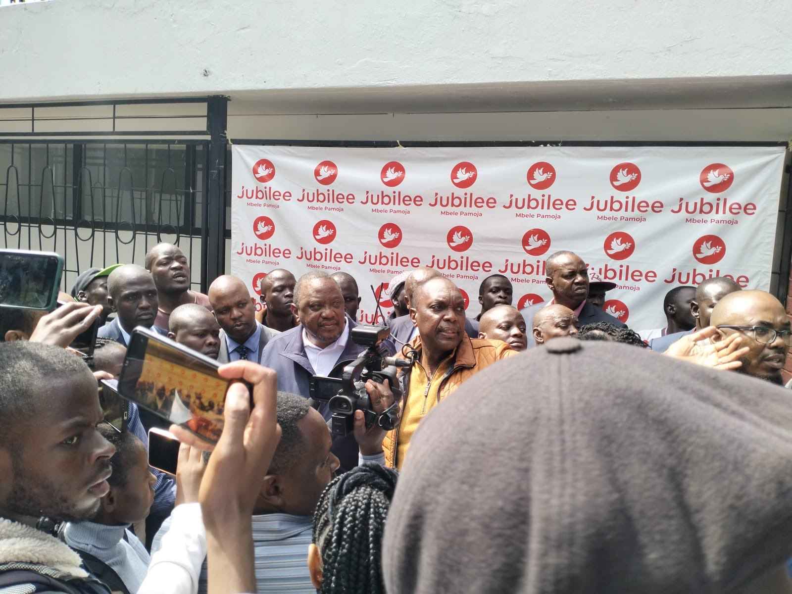 Uhuru Kenyatta with Jeremiah Kioni at Jubilee party headquarters.
