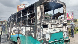 The remains of a bus set ablaze on Ngong road.