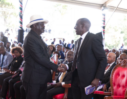 President William Ruto shakes hands with President William Ruto during the burial of Mama Mukami Kimathi.