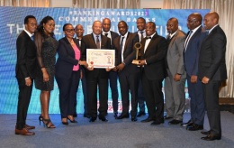 Equity Bank Kenya MD Gerald Warui (centre) holding certificate for the Best Tier One Bank in Kenya at the 2023 Think Business Awards.