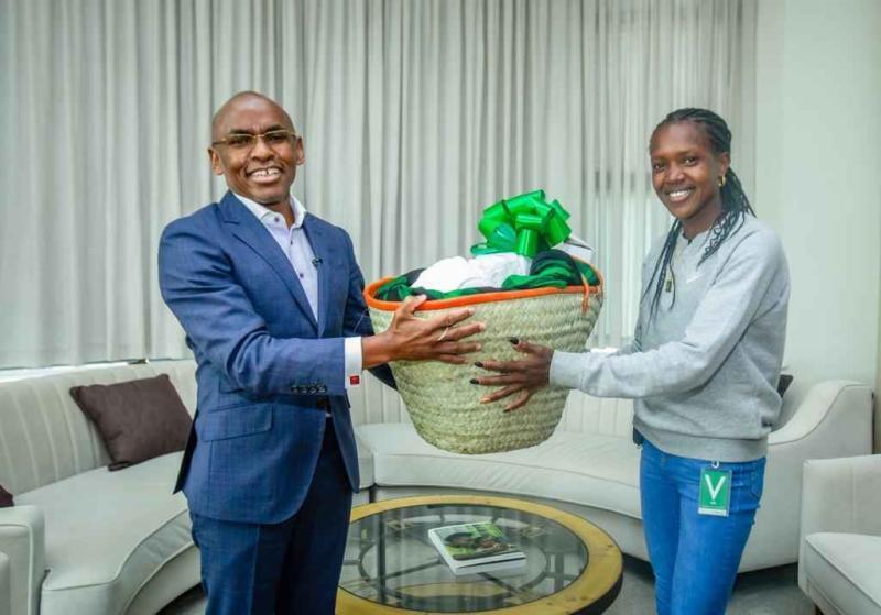 Safaricom CEO Peter Ndegwa and Faith Kipyegon.