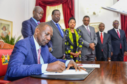President William Ruto signs the Finance Bill 2023 into law at State House, Nairobi.