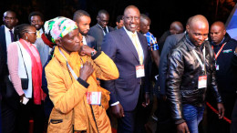 Pauline Waithira, a mama mboga, accompanying President William Ruto, then a presidential candidate, to a presidential debate.