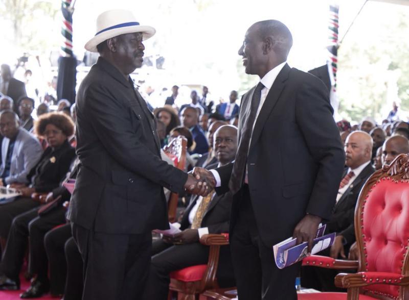 ODM leader Raila Odinga shakes hands With President William Ruto at Mama Mukami Kimathi's burial.