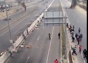 A section of the Mlolongo Nairobi Expressway being destroyed by protesters.
