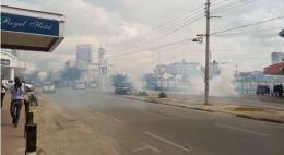 Police lob teargas in Mombasa to disperse protesters.