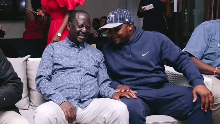 Lang'ata MP Phelix Odiwuor interacting with ODM leader Raila Odinga at a party in Karen.