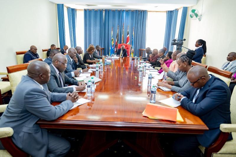 Deputy President Rigathi Gachagua receives documents from coffee stakeholders.