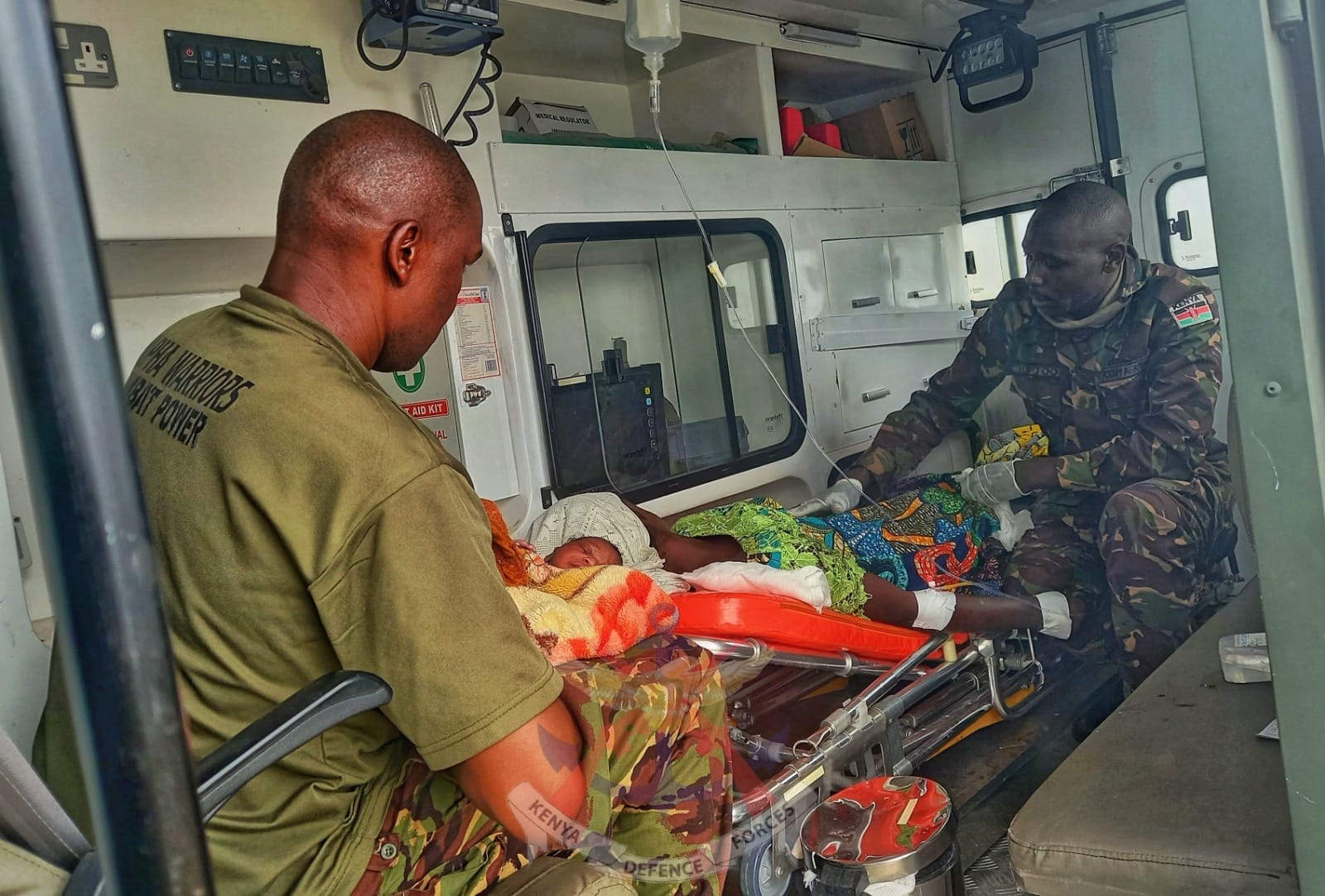 KDF soldiers help a woman deliver baby in DRC where they are conducting an operation.