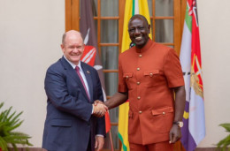 President William Ruto shakes hands with US Senator for Delaware Chris Coons.