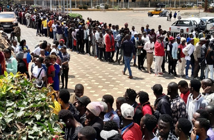 Kenyans lining up to have their eyeballs scanned.