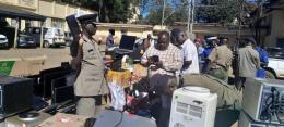 Police officers led by Uasin Gishu county commander Benjamin Mwanthi.