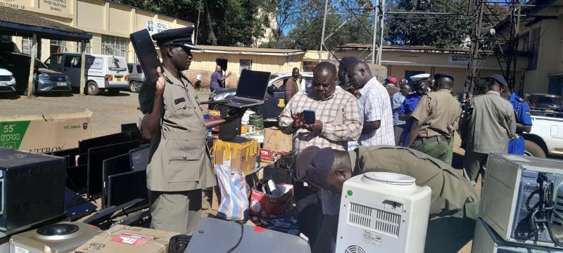 Police officers led by Uasin Gishu county commander Benjamin Mwanthi.