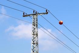 File image of marker balls on electricity transmission lines.