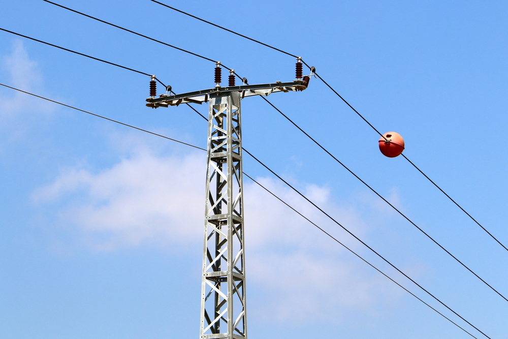 File image of marker balls on electricity transmission lines.